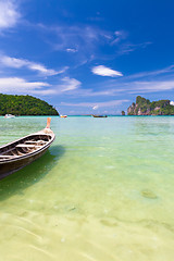 Image showing Wooden boat on a tropical beach.