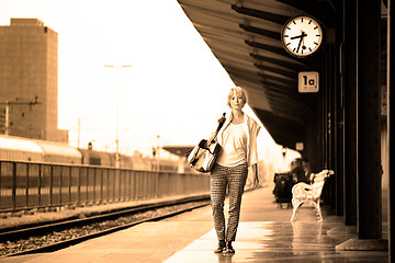 Image showing Lady waiting at the railway station.