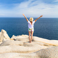 Image showing Woman practicing yoga at the beach.