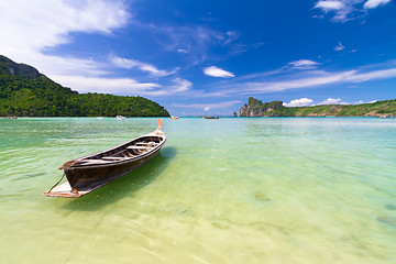 Image showing Wooden boat on a tropical beach.