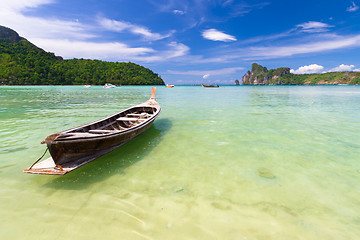 Image showing Wooden boat on a tropical beach.