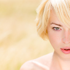 Image showing A portrait of beautiful young Caucasian woman outdoor.