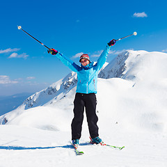 Image showing Excited woman skier.