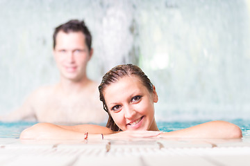 Image showing Young couple in the swimming pool.