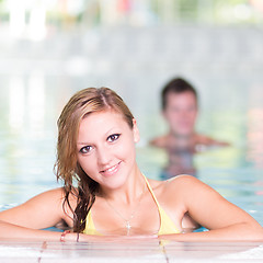 Image showing Young woman in the swimming pool.