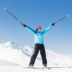 Image showing Excited woman skier.