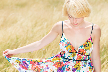 Image showing A portrait of beautiful young Caucasian woman outdoor.