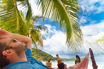 Image showing Man relaxing on a tropical beach.