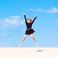 Image showing Girl jumping in the air