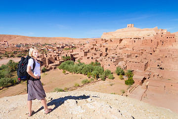 Image showing Traveler in front of  Ait Benhaddou, Morocco.