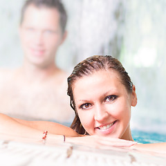 Image showing Young couple in the swimming pool.