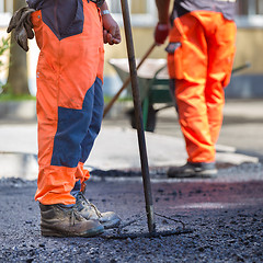 Image showing Asphalt surfacing manual labor.