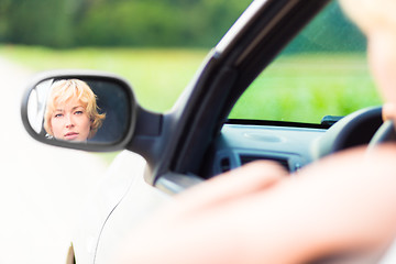 Image showing Lady driving a car.