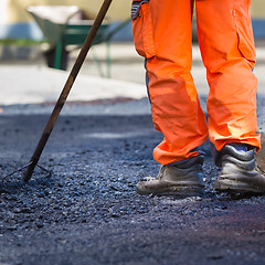 Image showing Asphalt surfacing manual labor.