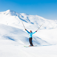 Image showing Excited woman skier.