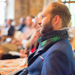Image showing Entrepreneur in audience at business conference.
