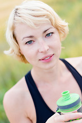 Image showing Portrait of woman drinking water outdoor