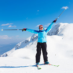 Image showing Excited woman skier.