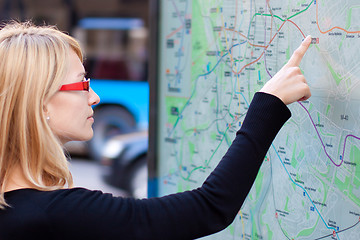 Image showing Woman looking on the metro map board