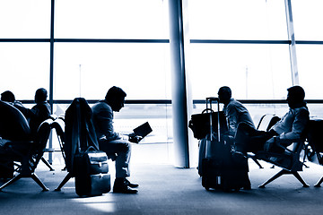 Image showing People traveling on airport silhouettes