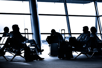 Image showing People traveling on airport silhouettes