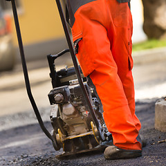 Image showing Asphalt surfacing manual labor.