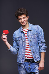 Image showing Denim man showing empty paper card