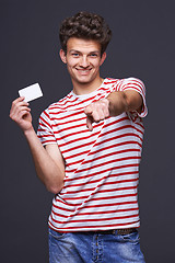 Image showing Man showing empty blank paper card sign