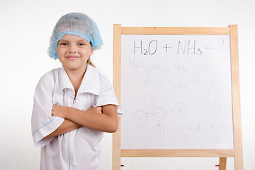 Image showing Portrait of a Girl chemist at the blackboard
