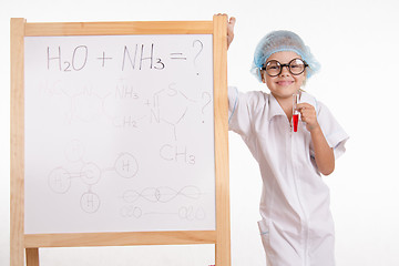 Image showing Pharmacist standing at the blackboard with a test tube