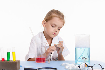 Image showing Girl with a pair of tweezers in the laboratory