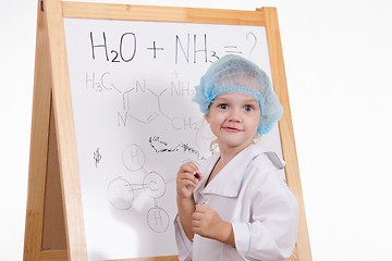 Image showing Chemist writes formulas on a blackboard