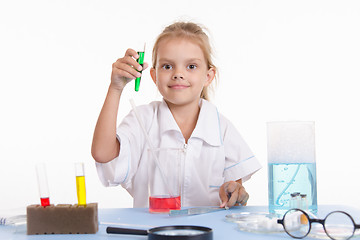 Image showing Chemist with green liquid in a test tube