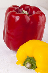 Image showing Red and Yellow Peppers on White Background