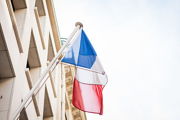 Image showing Flag of France fluttering under a serene blue sky