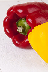 Image showing Red and Yellow Peppers on White Background