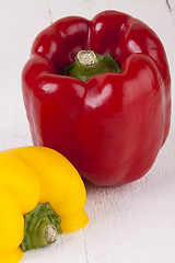 Image showing Red and Yellow Peppers on White Background