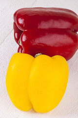 Image showing Red and Yellow Peppers on White Background