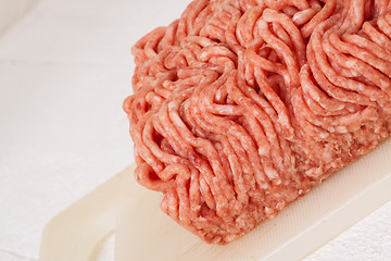 Image showing Block of commercial beef mince from a store