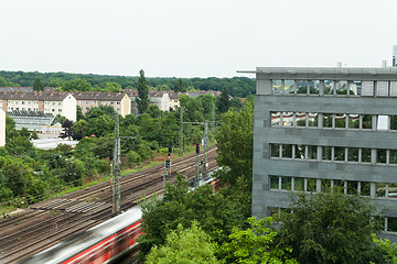 Image showing Fast moving train with red stripe