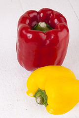 Image showing Red and Yellow Peppers on White Background