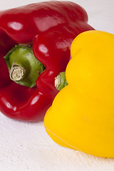 Image showing Red and Yellow Peppers on White Background