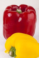 Image showing Red and Yellow Peppers on White Background