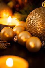 Image showing Warm gold and red Christmas candlelight background