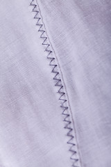 Image showing Closeup Small Buttons on White Cloth