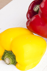 Image showing Red and Yellow Peppers on White Background