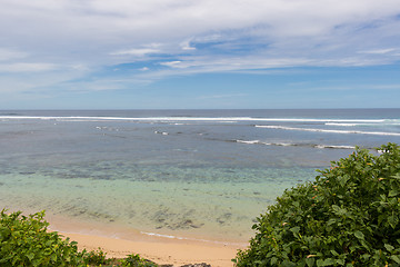 Image showing Beautiful tropical beach with lush vegetation