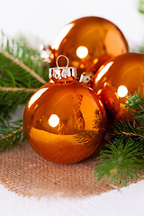 Image showing Shiny bright copper colored Christmas balls