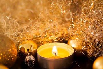 Image showing Warm gold and red Christmas candlelight background