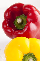 Image showing Red and Yellow Peppers on White Background